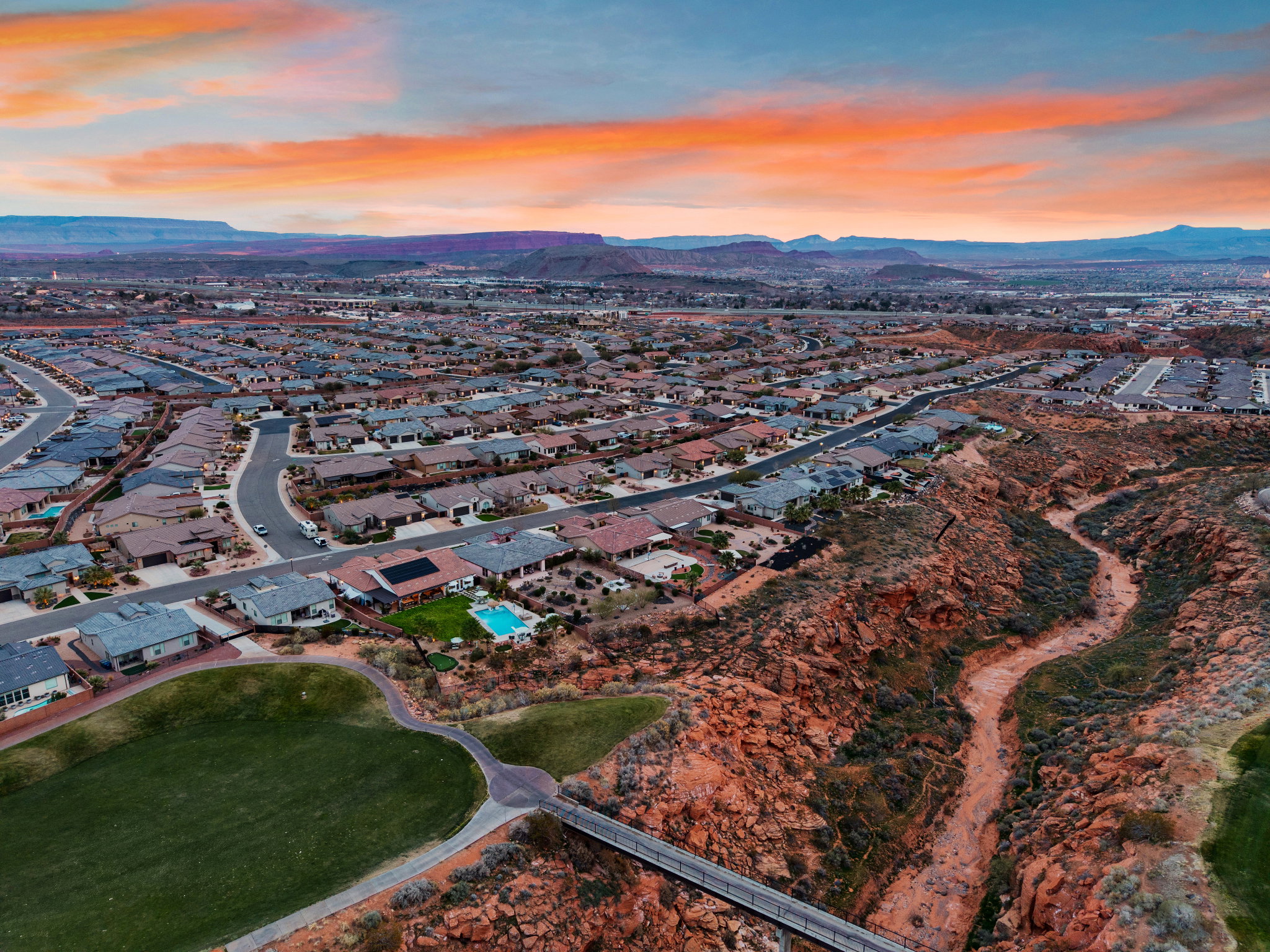 Aerial view of residential area featuring a mountainous background