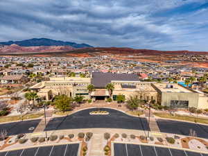 Aerial perspective of suburban area with a mountainous background