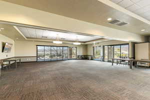 Lobby featuring a raised ceiling and recessed lighting
