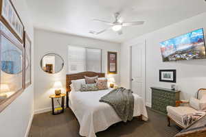 Bedroom featuring carpet flooring and a ceiling fan