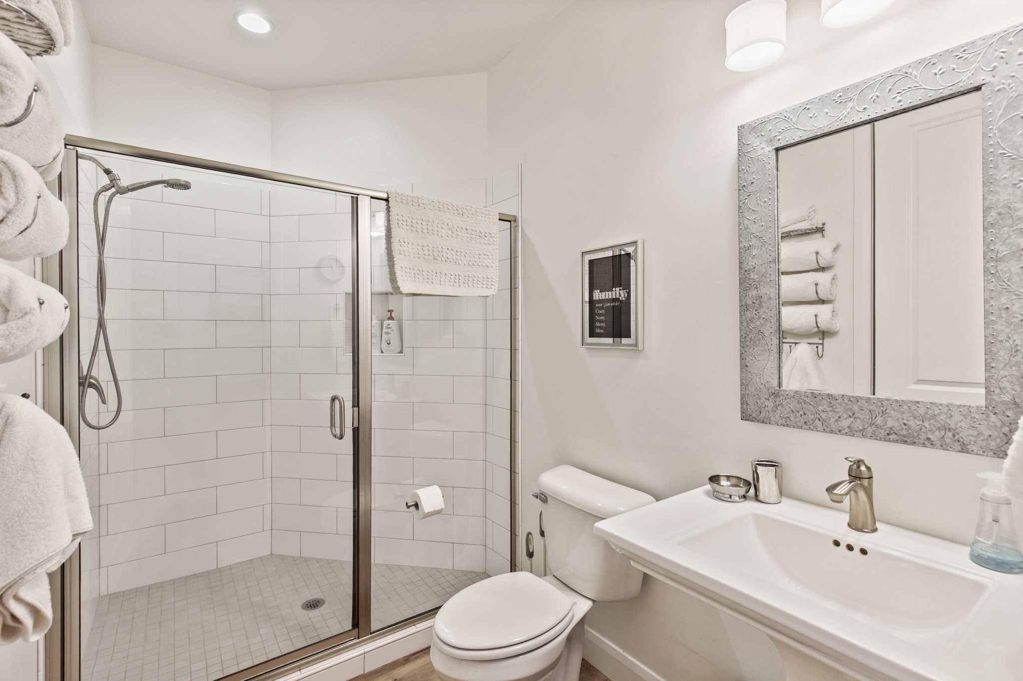 Bathroom with a shower stall and toilet