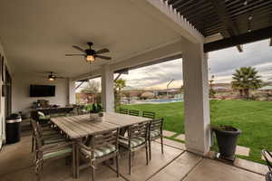 View of patio / terrace with an outdoor pool, a ceiling fan, and outdoor dining space