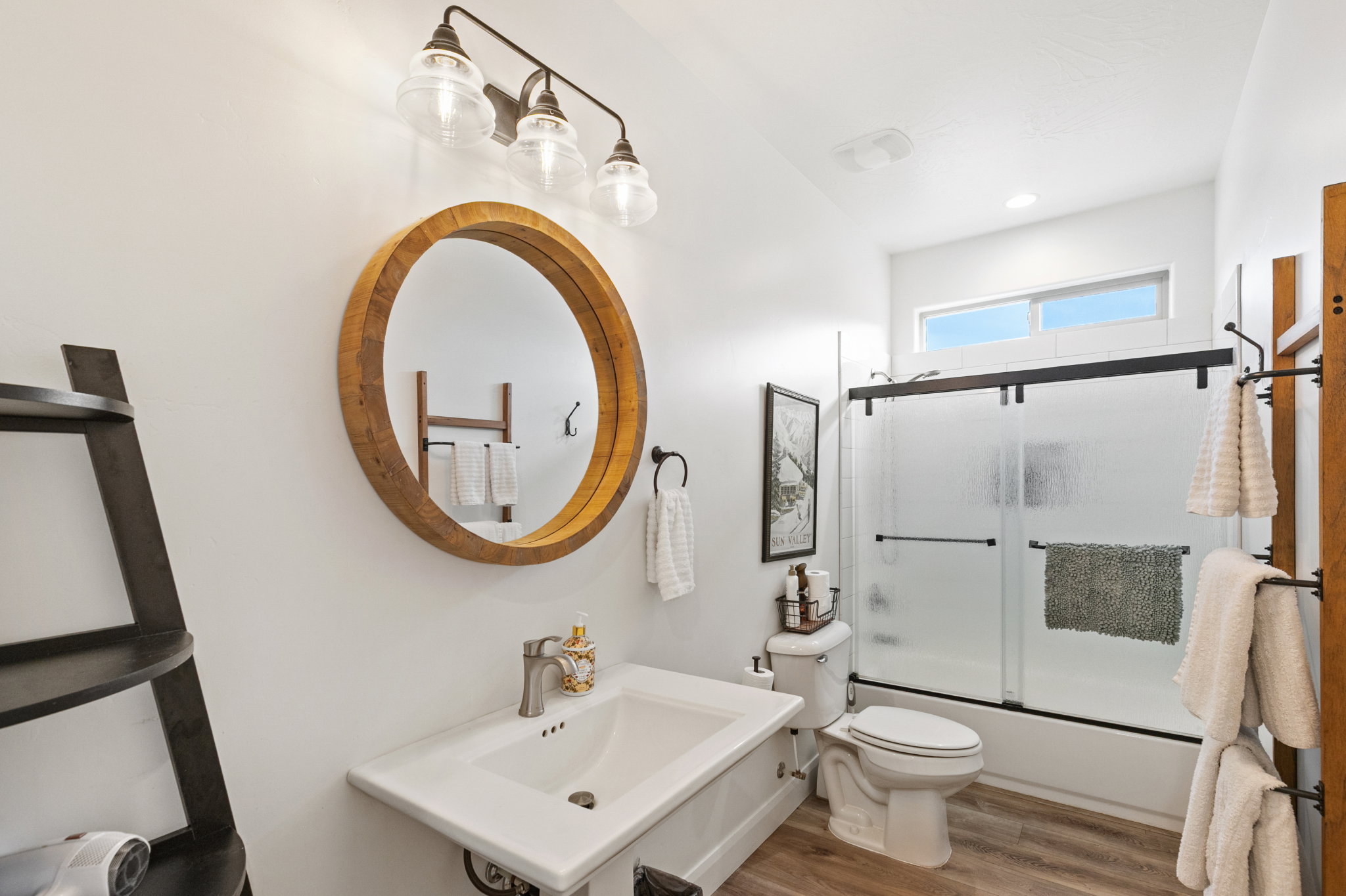 Full bathroom featuring shower / bath combination with glass door, wood finished floors, and recessed lighting