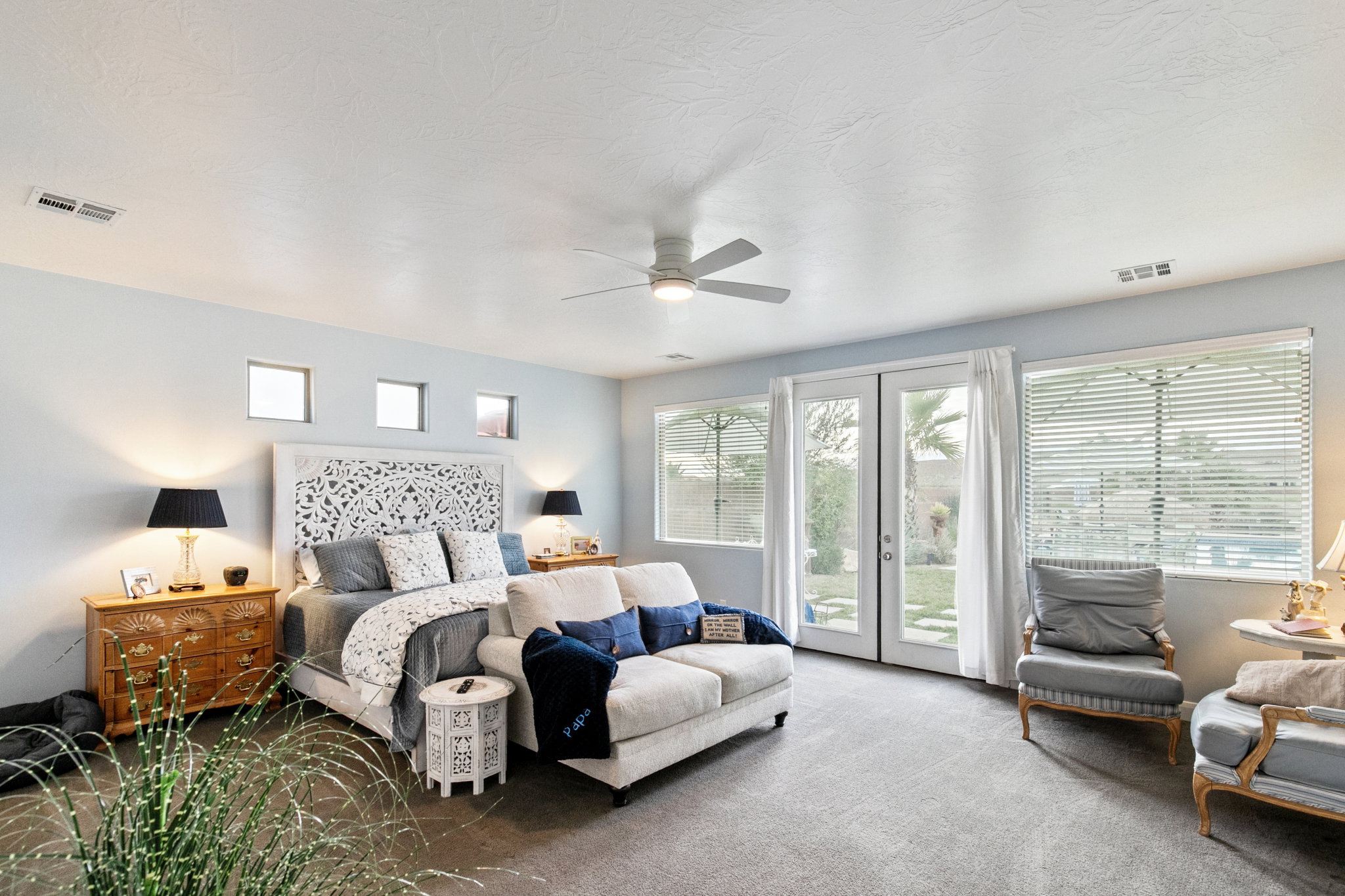 Carpeted bedroom featuring access to outside, french doors, and ceiling fan