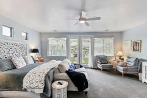 Bedroom featuring carpet, ceiling fan, access to outside, and french doors