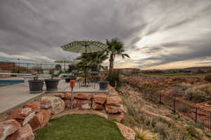 Fenced backyard with a patio area