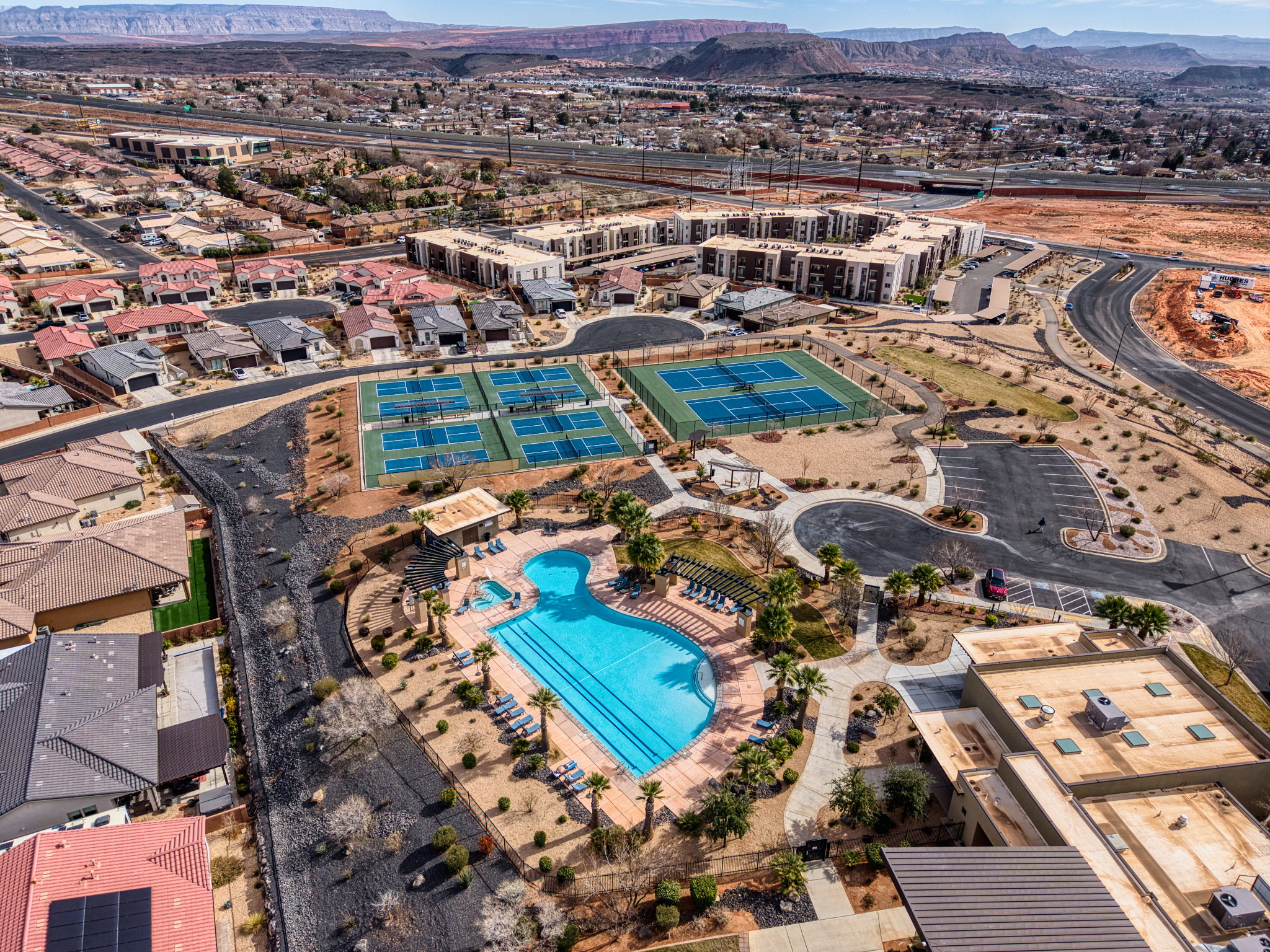 Aerial view of property's location with mountains and a pool area
