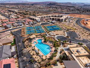 Aerial view of property's location with mountains and a pool area