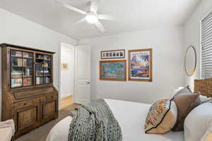 Carpeted bedroom with ceiling fan