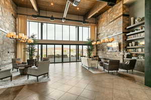 Lobby featuring a high wood beamed ceiling