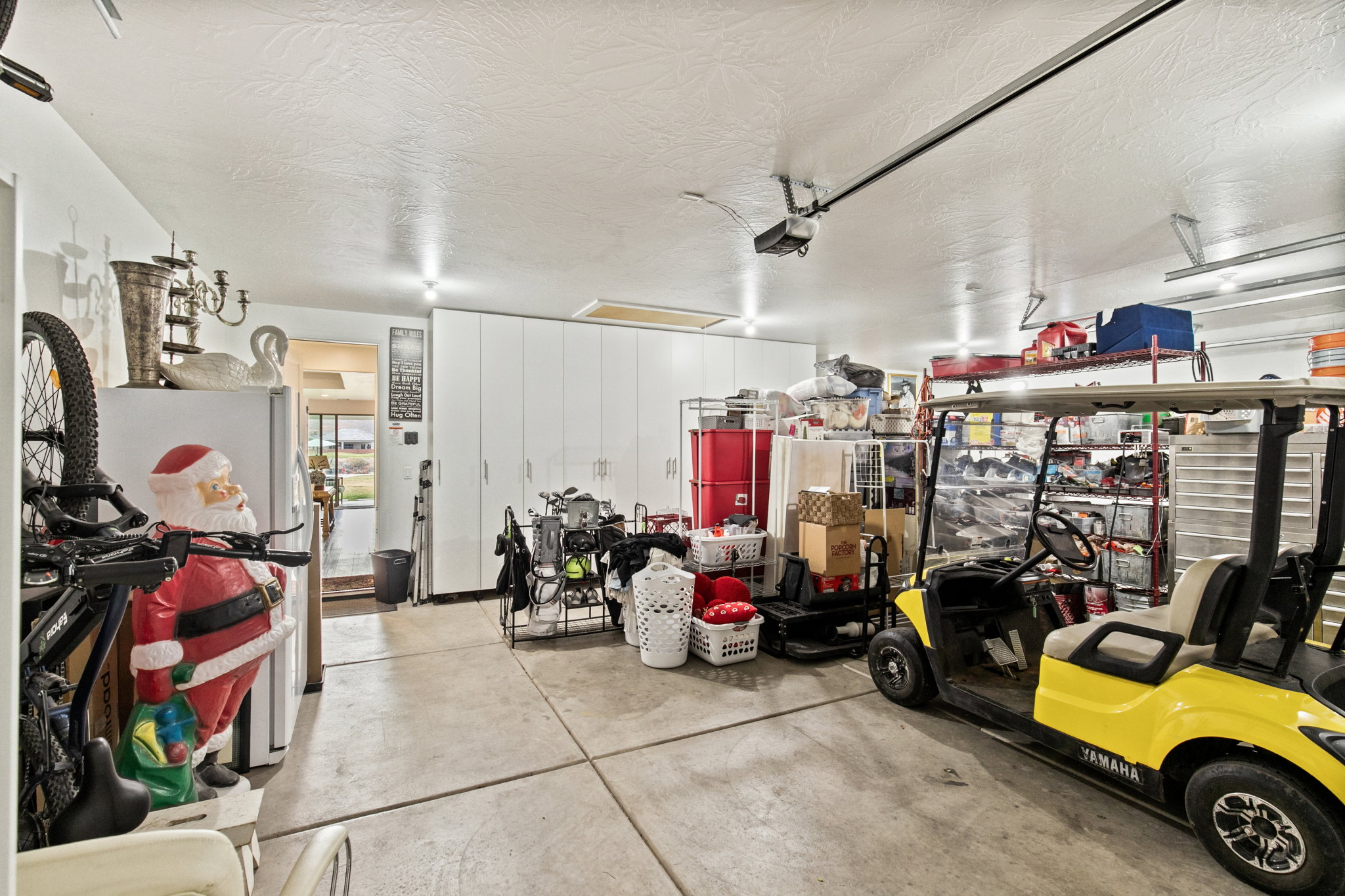 Garage with freestanding refrigerator