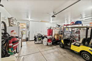 Garage with freestanding refrigerator