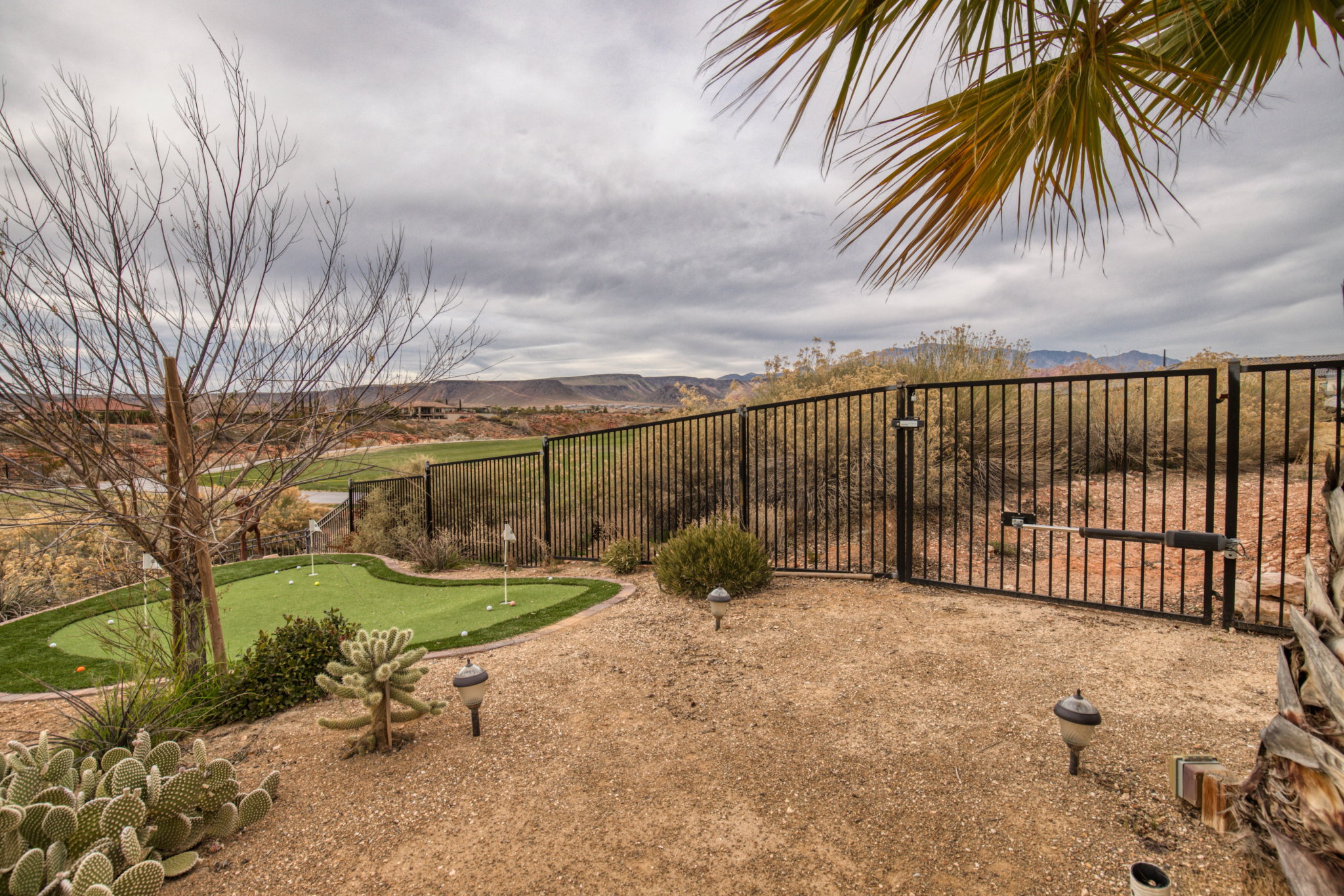 View of yard featuring an area to practice putting and a mountain view