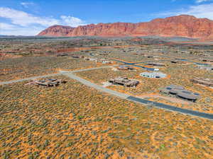 Overview of rural landscape with a desert landscape and a mountain backdrop