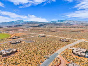 Aerial view of sparsely populated area with a mountainous background