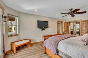 Bedroom featuring light wood-style flooring, recessed lighting, and ceiling fan
