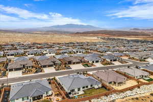 Aerial perspective of suburban area featuring a mountainous background