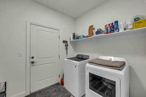 Laundry area with washing machine and clothes dryer