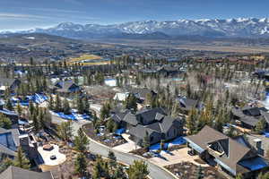View of property location featuring mountains and nearby suburban area