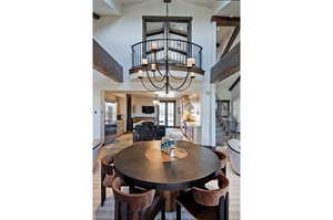 Dining room with hanging lights and lofted ceiling