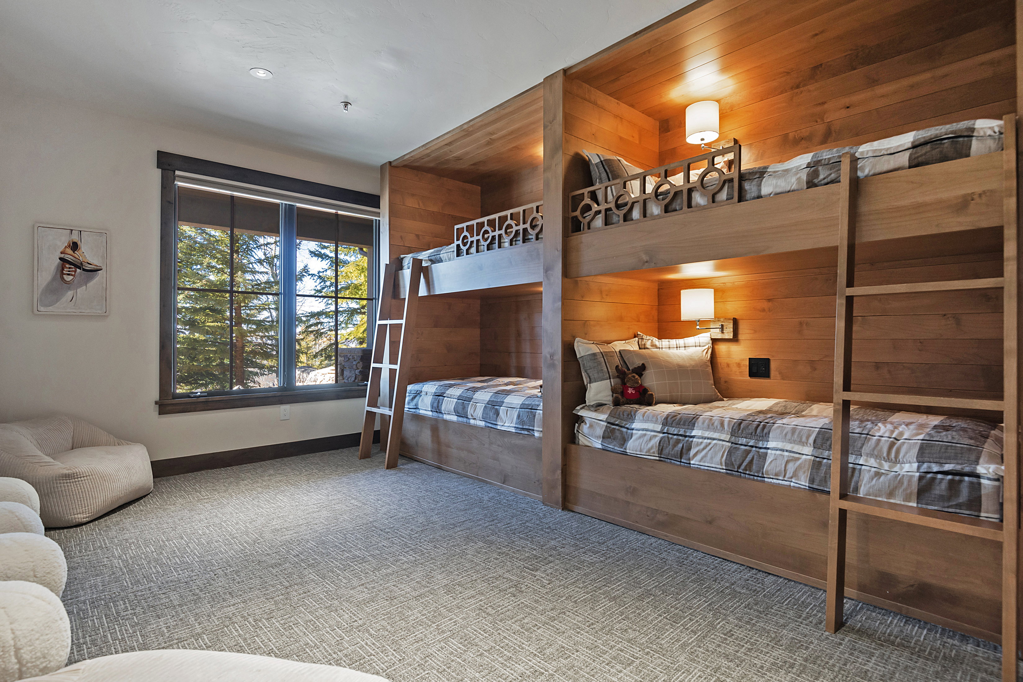 Bedroom with carpet flooring and wooden walls