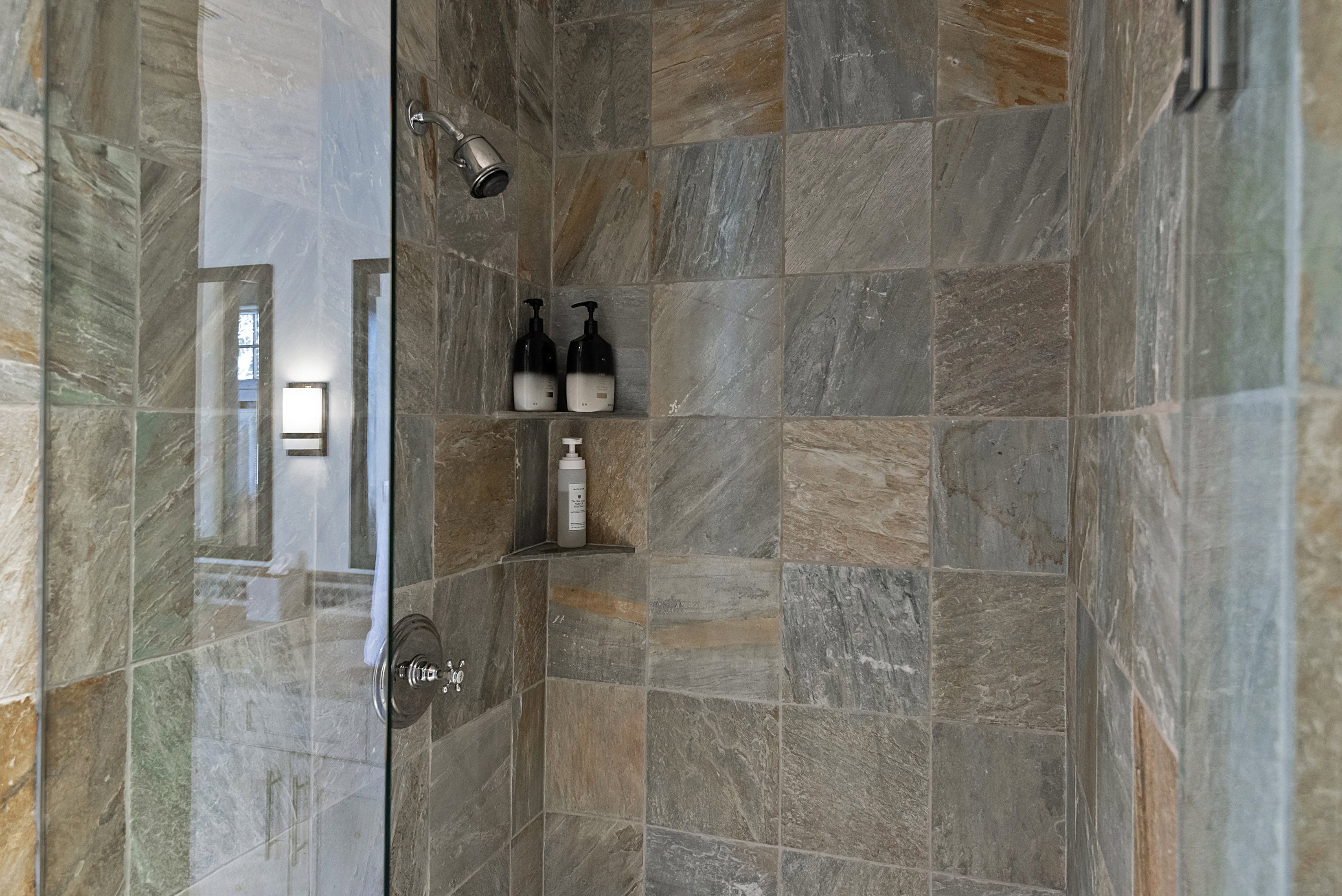 Full bathroom with a tile shower
