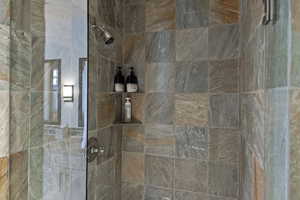 Full bathroom with a tile shower