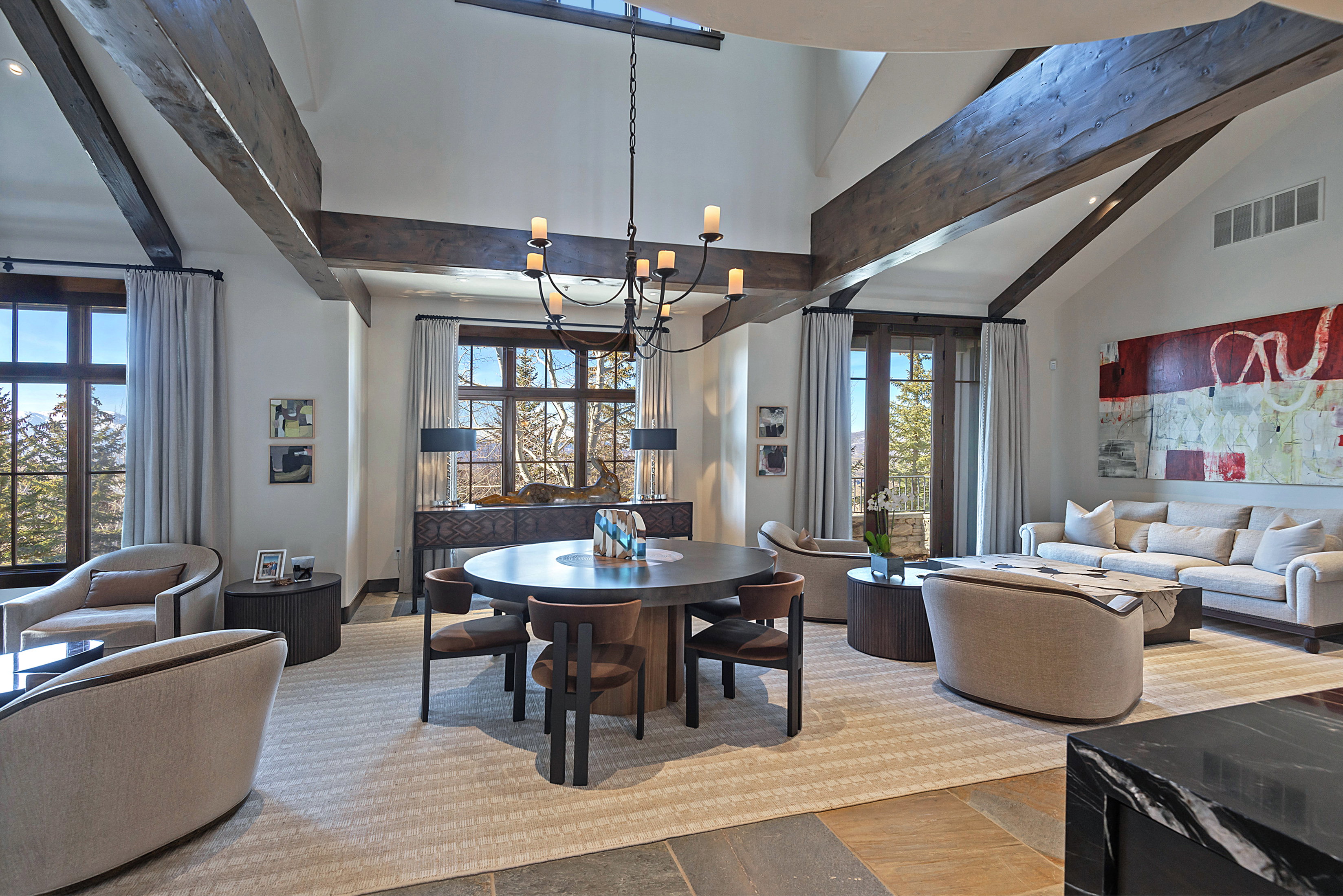 Dining space featuring vaulted ceiling and suspended lighting