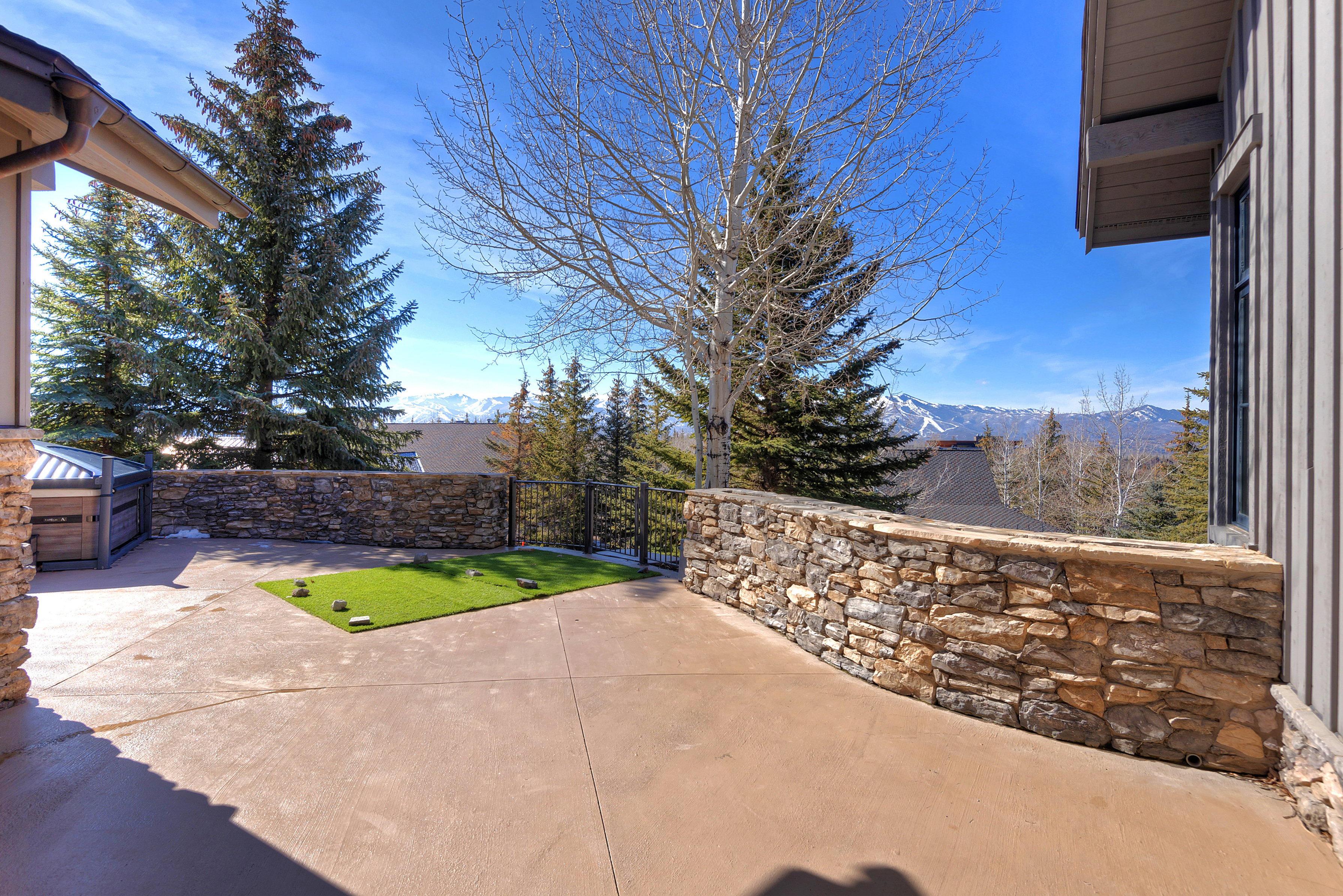 Fenced backyard featuring a mountain view and a gate