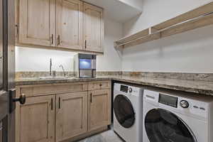 Laundry area with washing machine and dryer and cabinet space