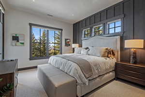 Carpeted bedroom featuring baseboards