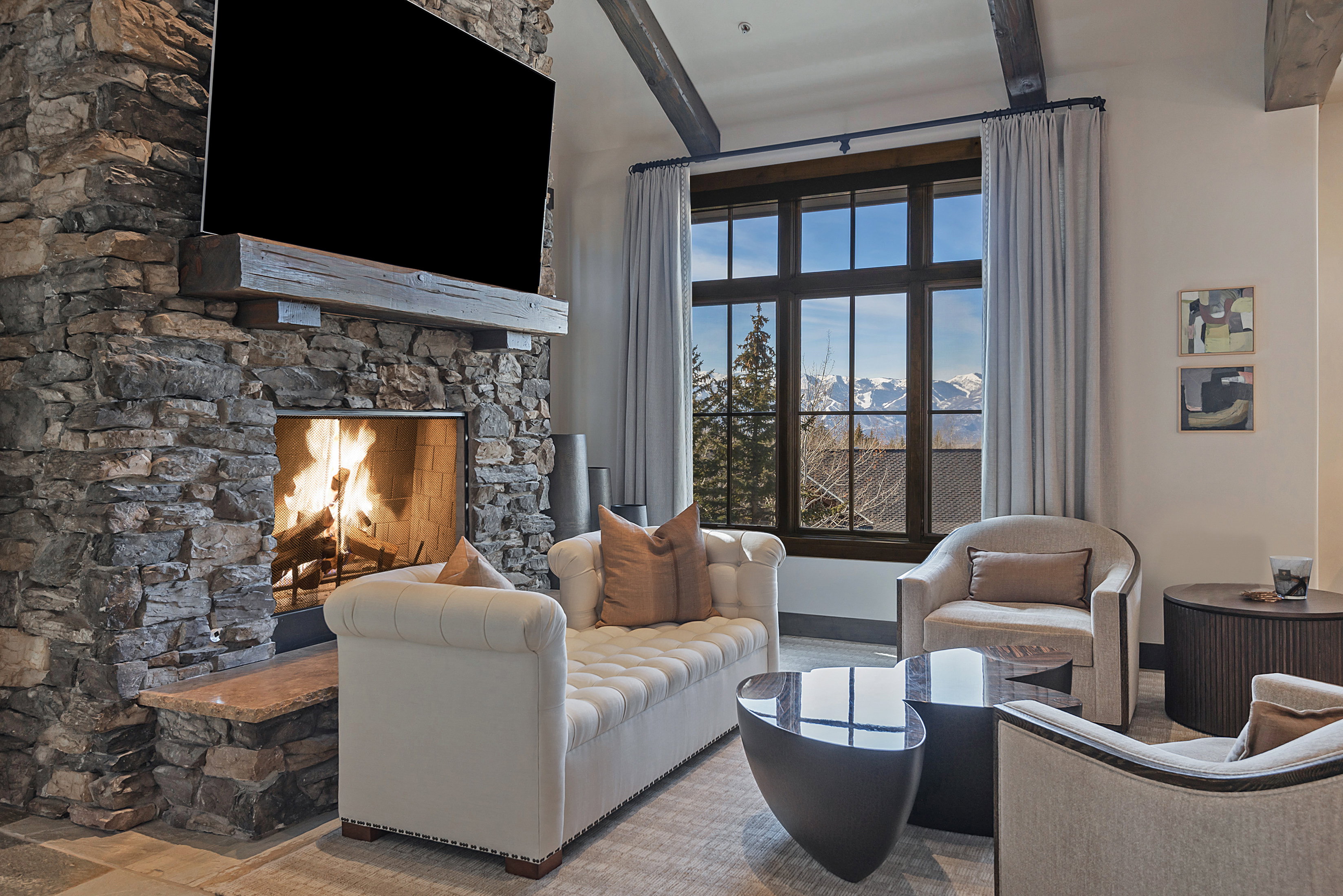 Living area featuring a fireplace and beam ceiling