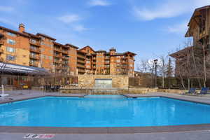 Community pool featuring a patio area