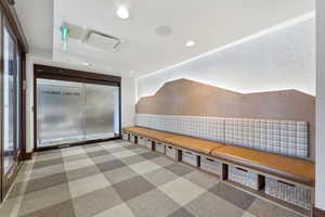 Interior space featuring recessed lighting and light colored carpet