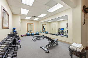 Workout area with a paneled ceiling