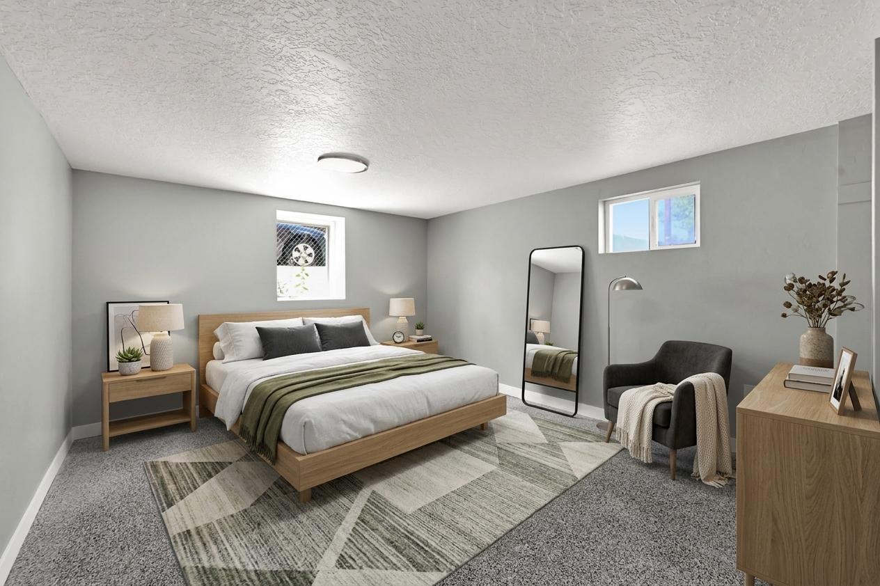 Spacious bedroom featuring light gray wall paint. Virtually staged to illustrate the home's potential.