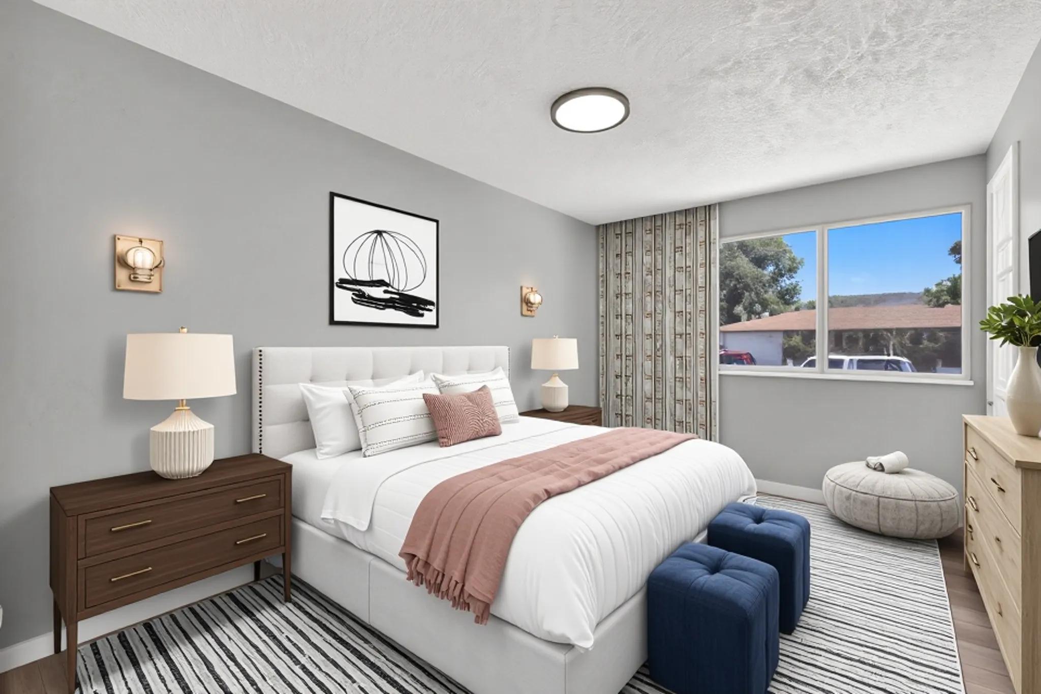 Bedroom with light gray painted walls with wood-finish flooring. Virtually staged to illustrate the home's potential.