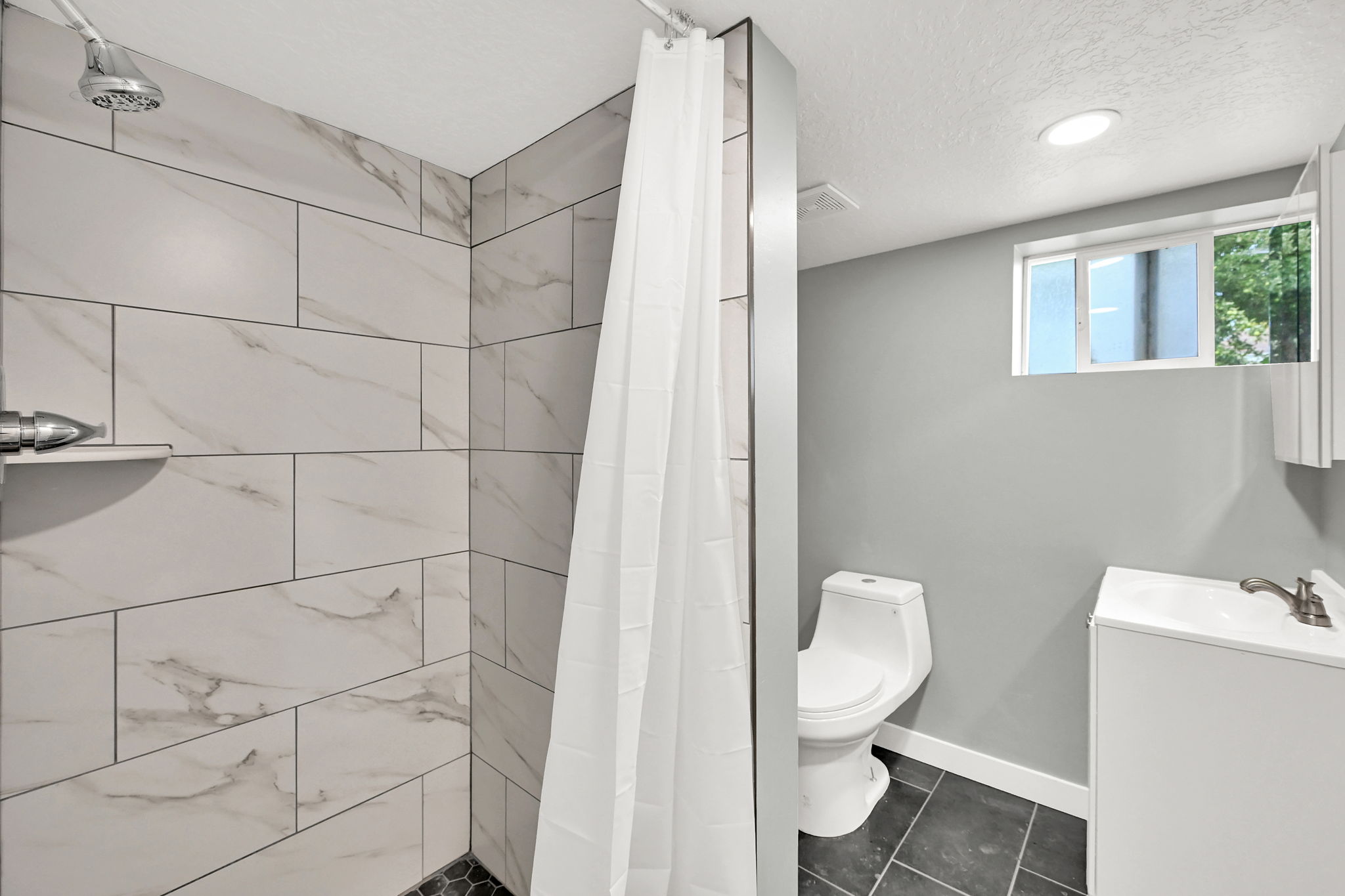 Bathroom featuring a shower.