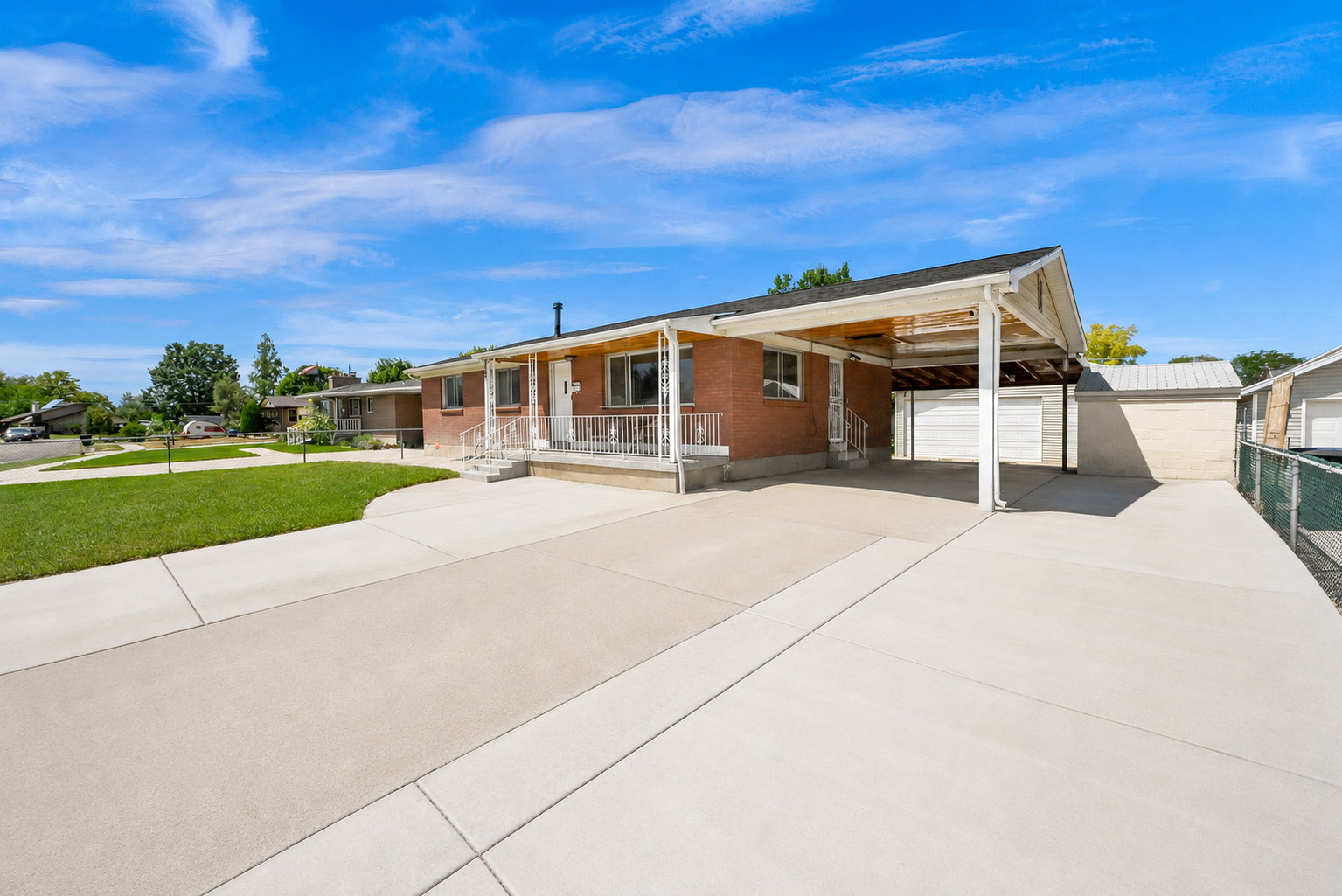 Brick exterior with a covered carport