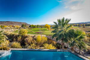 Outdoor pool featuring a mountain view and golf course view
