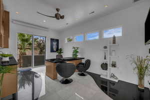Home office featuring ceiling fan and recessed lighting