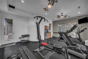 Gym with rubber floors and recessed lighting