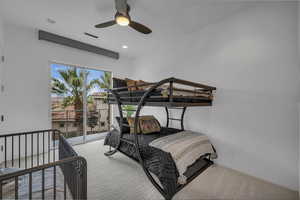 Carpeted bedroom featuring ceiling fan, access to exterior, and recessed lighting