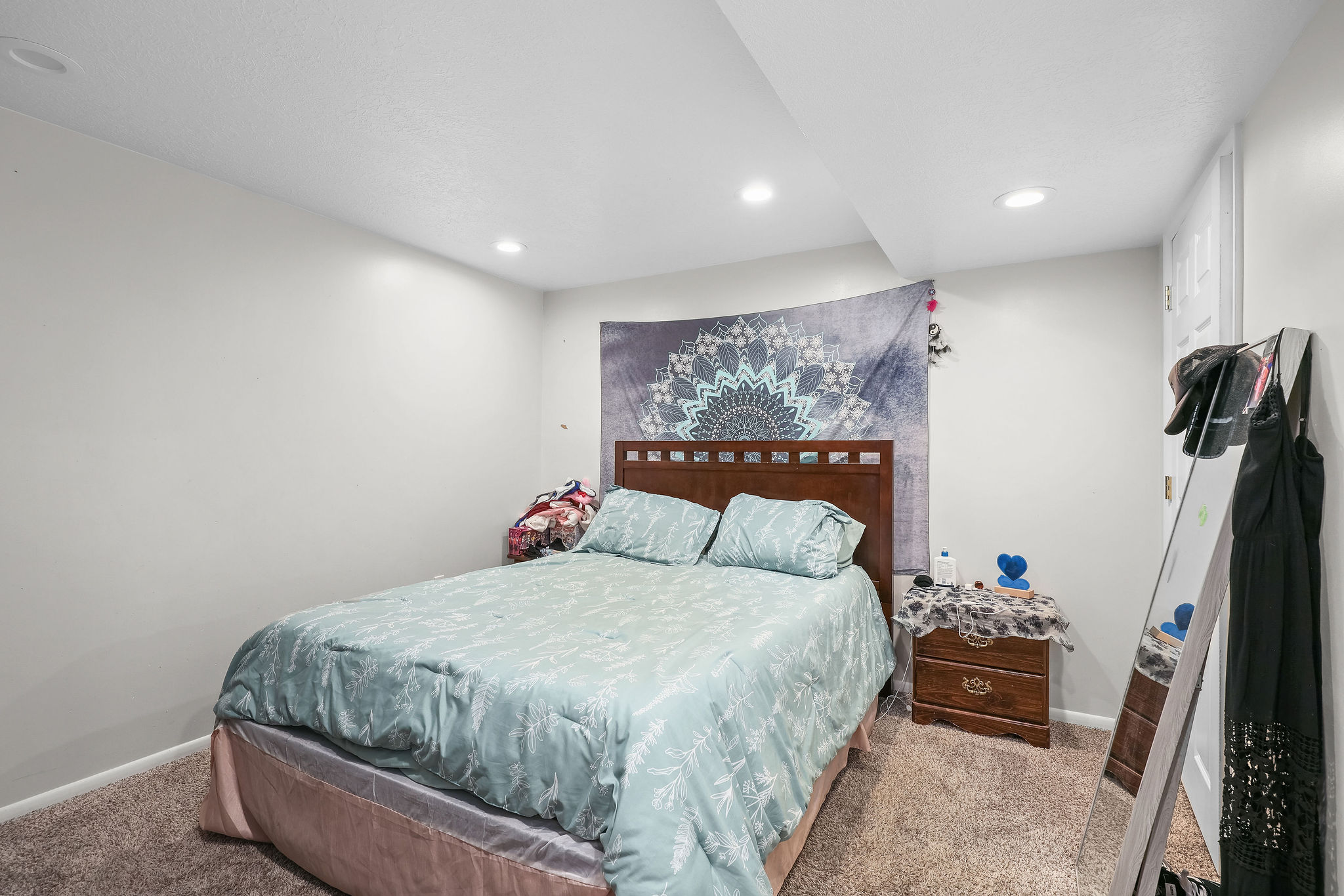 Carpeted bedroom featuring baseboards and recessed lighting