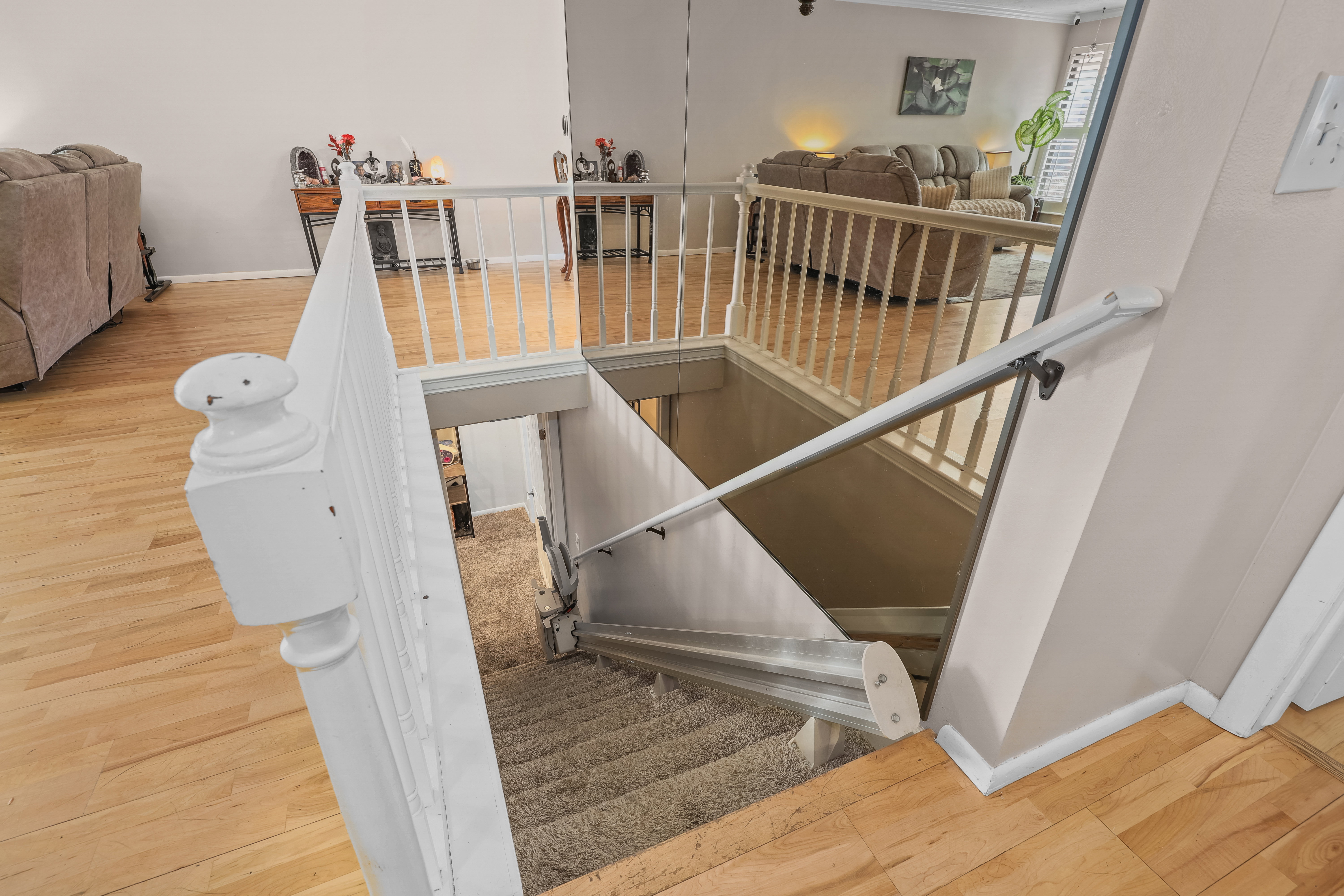 Stairway with wood finished floors and baseboards  Stair Chair