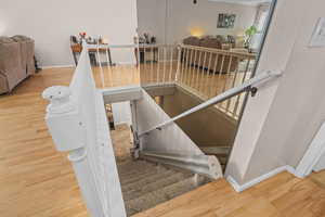 Stairway with wood finished floors and baseboards  Stair Chair