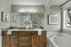 Full bath with a garden tub and double vanity