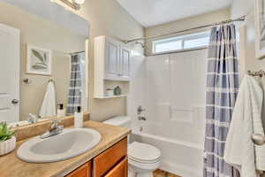 Full bath featuring vanity and shower / tub combo