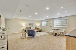 Living room featuring light carpet and recessed lighting