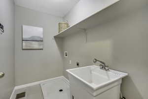 Laundry area with washer hookup and electric dryer hookup